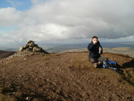 Ed has a cup of tea after arriving on summit