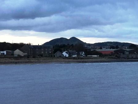 Looking back to Arthur's Seat during a teatime stroll by the sea