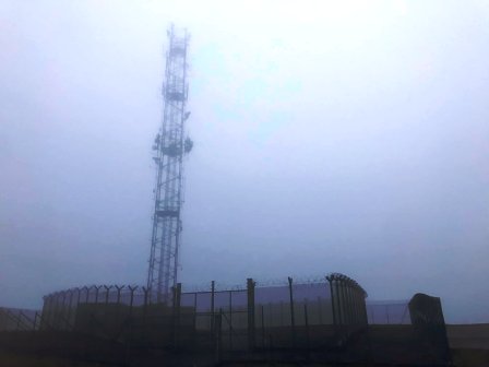 Mast and compound on summit - formerly an army base