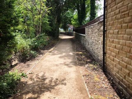 Footpath to make your way out of the estate towards the footbridge