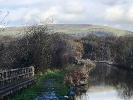 Walking along the Macclesfield Canal towpath, with Croker Hill in the background