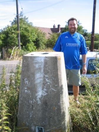 Tom by the trig point in Bradfield