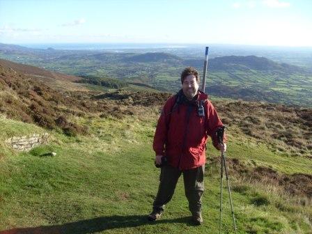 Tom on the later approach, with good views opening up behind