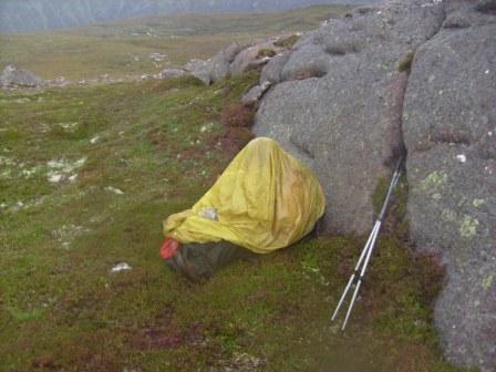 Jimmy sheltering from rain and midges