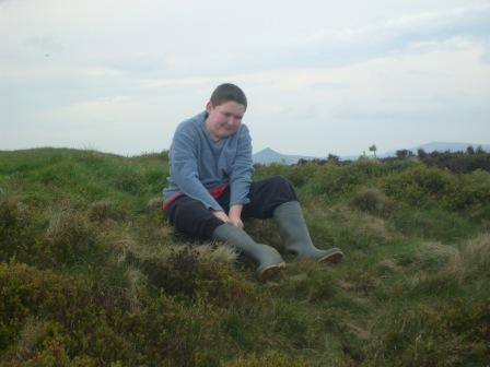 Liam on the summit, with Shutlingsloe visible behind