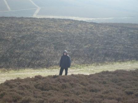 Liam ambles up the maze of tracks to the summit