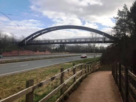Approaching the footbridge over the A523 Silk Road