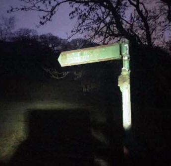 Public footpath sign on the Hollins