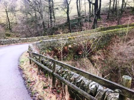 The public footpath follows the farm access road to the A537