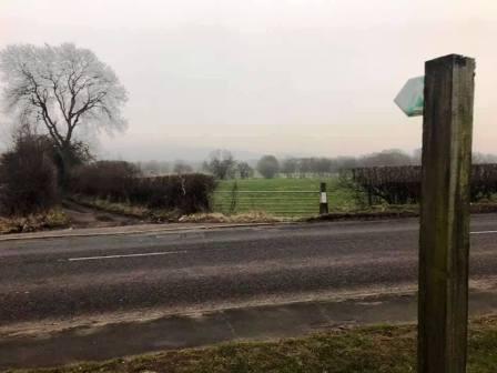 Public footpath that initially follows the access road for Danes Moss Farm