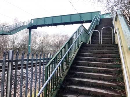 Railway footbridge over into Danes Moss