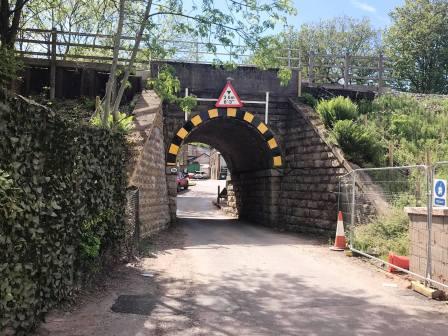 Pass under the viaduct then turn immediate left