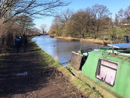 Continue walking along the canal towpath