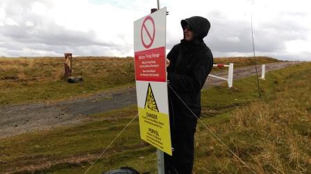 Jimmy setting up by the warning sign!