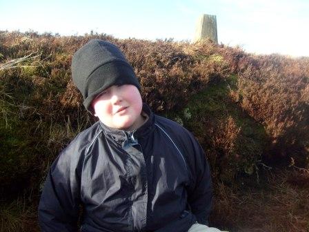 Liam sits in the hole for shelter during the activation