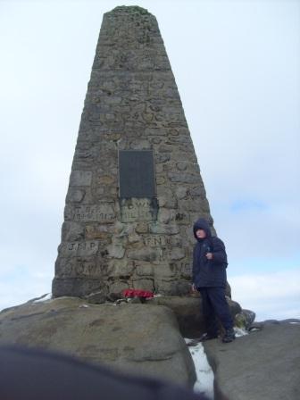 Liam arrives at the summit obelisk