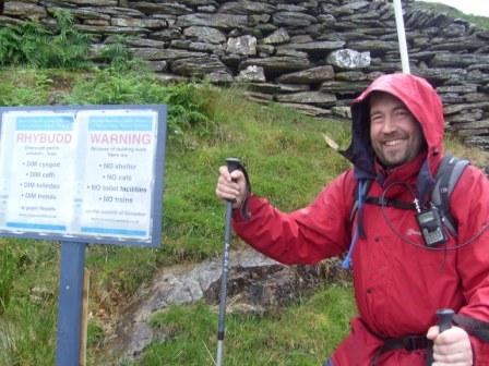 Tom by the warning sign, early on the Watkin Path