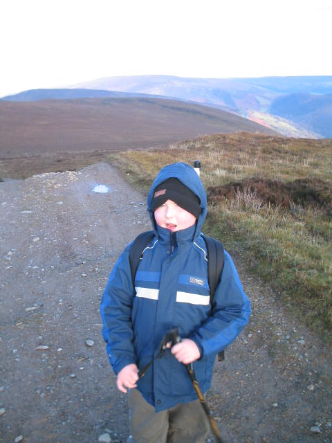 Liam arrives on the summit of Moel y Gamelin