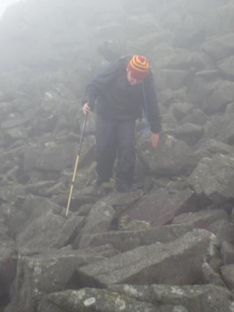 Liam picks his way down the rocky section from the summit