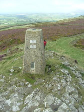 The summit trig on Mynydd Rhiw - and Tom setting up the aerial