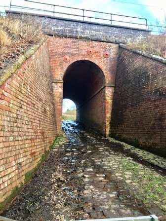 Cobbled footpath under the railway