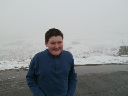 Up on Kirkstone Pass.  Behind Liam (honestly) is Red Screes.