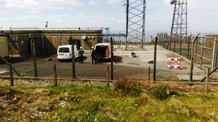 Men at work on the masts on Mullaghcarn