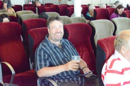 Tom relaxing with a beer on the return ferry