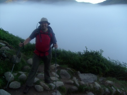 Tom climbing above the early morning mist