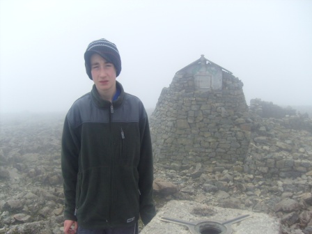Jimmy in front of the old tower, now an emergency shelter