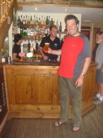 Tom eagerly anticipates this pint of ale!