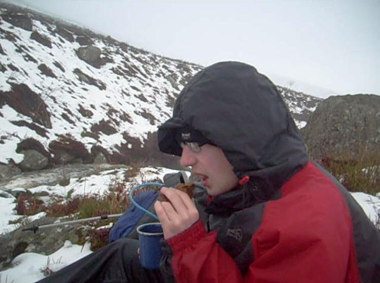 Jimmy resting and snacking by the stream