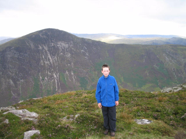 Jimmy on the summit of Creigiau Gleision GW/NW-028 with Pen Llithrig y Wrach GW/NW-013 in the background