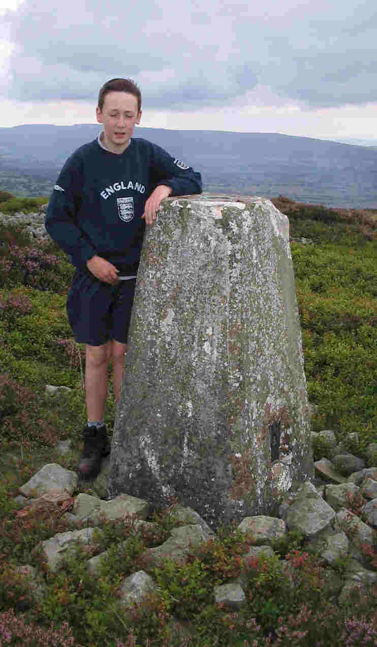 Jimmy at the trig point on Heath Mynd